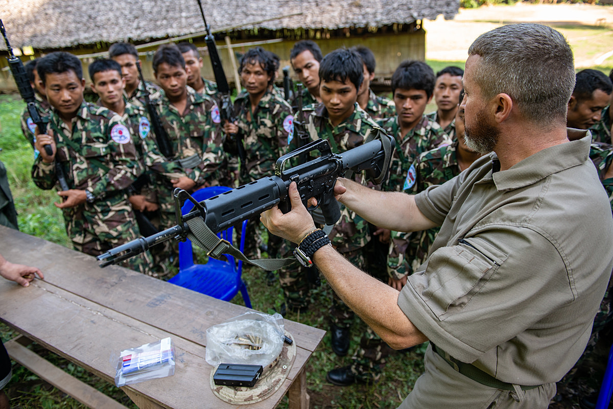 Instructors from the South African Field Ranger College conduct weapons training for Karen Forestry Department (KFD) wildlife protection units as part of a program to enable effective tactical patrol and enforcement operations. Myanmar, 2013. Adam Oswell / We Animals