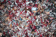 The remains of processed and colourfully dyed leather lie at the edge of the street in Hazaribagh, the quarter of Dhaka known for its tanneries.