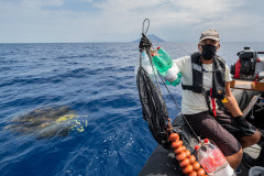 Sea Shepherd activists destroying illegal Fishing Aggregating Device (FAD).