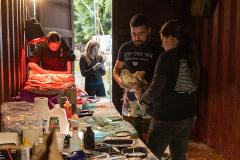 An activist administers medical aid to a chicken rescued from one of the various Kaporos religious ritual sites in Brooklyn. USA, 2022. Molly Condit / We Animals