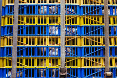 Chickens packed into plastic crates piled more than 10 feet high, wait on a transport truck to be unloaded outside a kosher poultry store. USA, 2022. Victoria de Martigny / We Animals