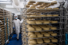 Miyoko's Creamery founder Miyoko Schinner in a refrigerated room full of aging cashew cheeses.