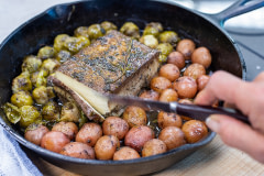 Miyoko Schinner, founder of Miyoko's Creamery, creates a buttery tofu and vegetable recipe in the test kitchen at their headquarters.