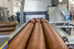 Cooked Tofurky deli meats are next sliced, weighed, and packaged to be shipped worldwide.