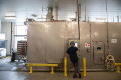 A Tofurky worker monitors measurements on a computer screen at the plant.