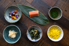 A display of fresh ingredients with cultivated salmon, made by WildType, a pioneer in cellular agriculture.