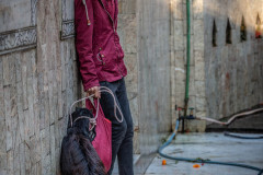 A worshipper and a goat, moments before the animal is sacrificed.