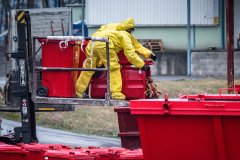 Dead hens are emptied into a dumpster from a refuse container outside the barns at an egg farm near Prague. Czechia, 2021. Lukas Vincour / Zvířata Nejíme / We Animals