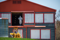 People at a duck farm in a biosecurity zone. It's possible that birds diagnosed with the highly pathogenic H5N1 virus were found here. Canada, 2022. Jo-Anne McArthur / We Animals
