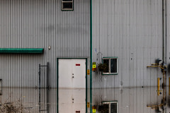 A broiler shed sits partially submerged in the floodwaters in Abbotsford, BC.