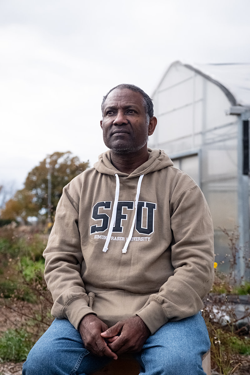 A portrait of Gabriel Allahdua, a labour organizer with Justicia for Migrant Workers and a former migrant worker from St. Lucia. Gabriel worked in Leamington, Ontario greenhouses under the Seasonal Agriculture Workers Program (SAWP) and his experiences under the frequently cited exploitative conditions created by the SAWP led him to becoming an advocate for other migrant workers and writing his memoir, Harvesting Freedom. Sundance Harvest Urban Farm, Toronto, Ontario, Canada, 2024. Ira Moon / We Animals