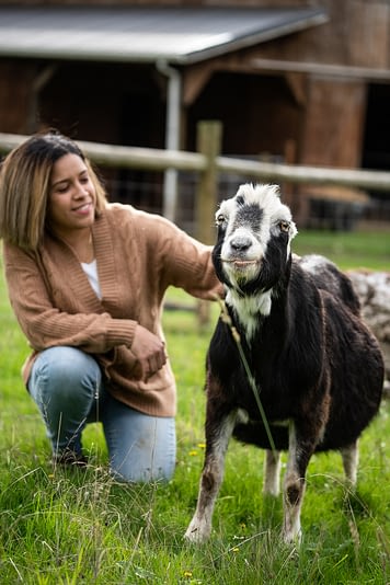 Erin Wing, Deputy Director of Investigations at the animal advocacy NGO Animal Outlook, spends time with Smokey at Wildwood Farm Sanctuary & Preserve. Photo: Jo-Anne McArthur / #unboundproject / We Animals Media