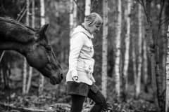 Piia with one of the many horses she has rescued at Tuulispaa sanctuary. Finland, 2015.