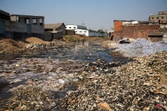 A contributory to the River Buriganga in Hazaribagh, Dhaka, is littered with rubbish and the remains of leather.  According to a report by the Blacksmiths Institue of New York in 2013, Hazaribagh is the fifth most polluted area in the world.