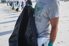 BP-hired clean-up workers to troll the Dauphin Island beaches for animals, oil and debris. USA, 2010.