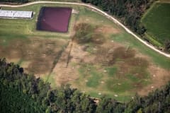 Aerial view of manure being sprayed onto fields. North Carolina, USA.
