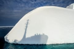 The shadow of the Bob Barker against an iceberg. Antarctic Ocean, 2010.