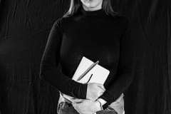 Jessica Scott-Reid, a Canadian journalist who regularly covers animal issues and who is party to the Charter Challenge against ag-gag legislation in Ontario. She poses with a notepad as part of our Advocates Against Ag-gag portrait series.
