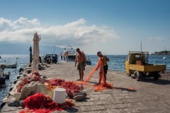 Fishermen preparing fishing nets.