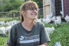 Susie Coston with rescued hens. USA, 2013.