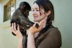 Samantha Dewhirst with an orphaned baboon at CARE sanctuary. South Africa, 2016.