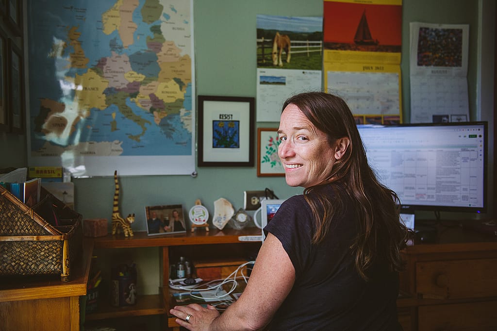 Grantwriter Hannah Murray sits at her desk and shares some insight on the need for trust-based philanthropy as a way to increase equity for groups who have traditionally had less access to funding. Photo by Victoria de Martigny / #unboundproject / We Animals Media