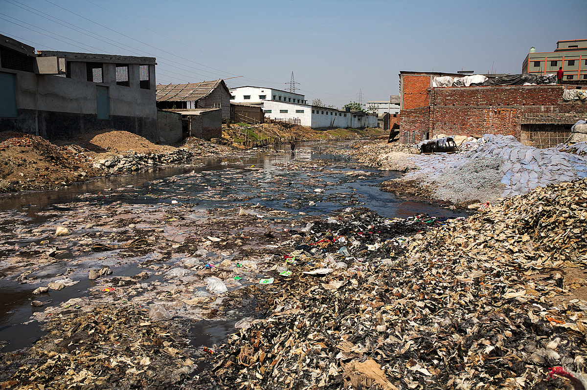 A contributory to the River Buriganga in Hazaribagh, Dhaka, is littered with rubbish and the remains of leather. According to a report by the Blacksmiths Institute of New York in 2013, Hazaribagh is the fifth most polluted area in the world. Bangladesh, 2015. Christian Faesecke / We Animals Media
