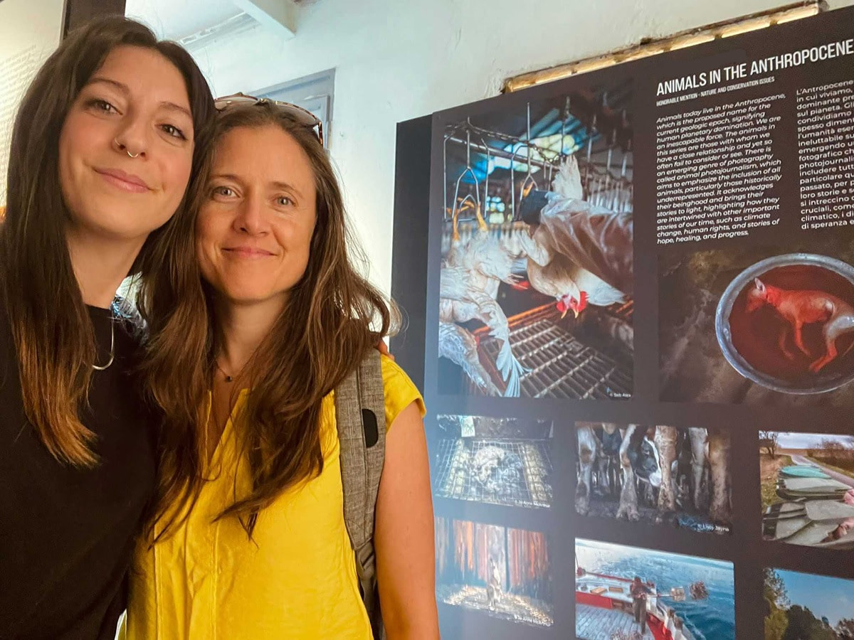 WAM’s Senior Fellow Selene Magnolia and Founder Jo-Anne McArthur by our storyboard at the SIPA 2023 exhibition. Photo credit: Javier Aznar.