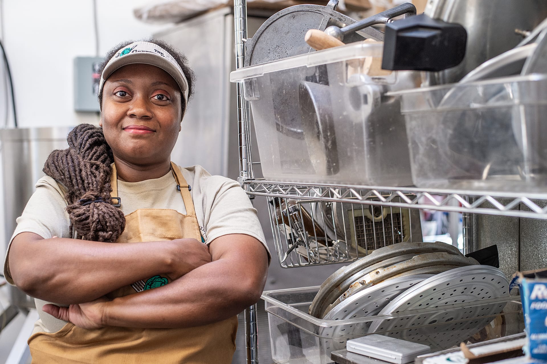 Vegan advocate, humanitarian, and entrepreneur Brenda Sanders working in the kitchen at her vegan restaurant in Baltimore, The Greener Kitchen. Photo by: Jo-Anne McArthur / #UnboundProject / We Animals Media.