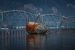 A feed silo floats by a farm's irrigation system in the aftermath of the 2021 Abbotsford, BC floods.