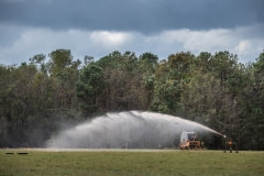 Manure being sprayed on a field next to Elsie Herring's family home. North Carolina, USA.