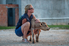 Activist Lesley Moffat holds a calf in distress at the Bulgarian-Turkish border. Turkey, 2018.