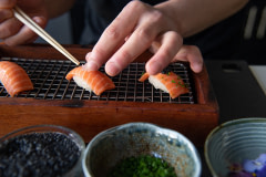 Chef Jun Sog works with WildType's cultivated salmon.