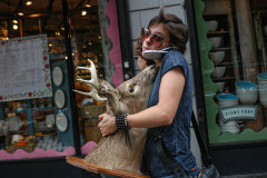 Woman with a mounted deer head. USA, 2005. Jo-Anne McArthur / We Animals Media