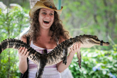Tourist with an alligator during a presentation. Florida, USA, 2011.