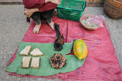 Bird, meat, and produce at the Luang Prabang market.