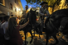 The Matadors circle the outside of the arena on horseback and wave to the party-goers. Spain, 2009.