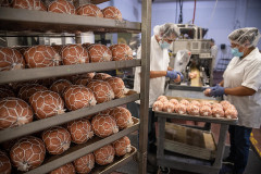 Tofurky plant-based ham style roasts roll through machines and along conveyor belts to be packaged and shipped worldwide. USA, 2021. Jo-Anne McArthur / We Animals Media