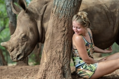 Jade Aldridge with an orphaned rhino. South Africa, 2015.