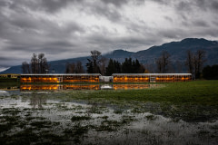 The Taisuco Canada Agriculture Corporation greenhouse reflected in receding floodwaters in Abbotsford, BC.