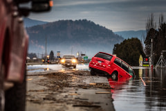 A minivan sits partially submerged in the floodwaters after the driver drove off the embankment on South Parallel Road in Abbotsford, BC. This was a common scene driving up and down the roads of the Sumas Prairie.