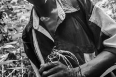 Dominic holding a snare in the Budongo Forest where efforts are continually underway to end poaching. Uganda, 2009.