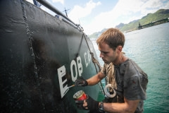 Darius, painting "Bob Barker" onto the side of the Sea Shepherd vessel. Mauritius, 2009.