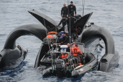 Ady Gil crew being rescued by the Bob Barker crew, after their boat was rammed. Antarctic Ocean, 2010.