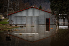 One of the many barns sitting in the floodwaters of Abbotsford, BC during the 2021 flooding.