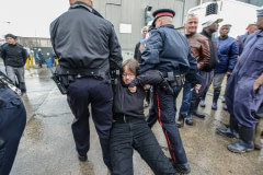 Jenny McQueen being arrested at a protest. Canada, 2014.