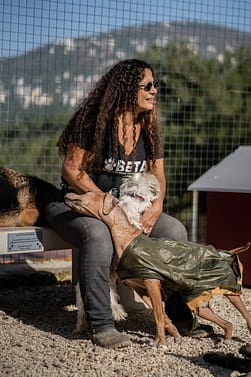 Helena Hesayne from Beirut Ethical Treatment for Animals spending time with the dogs at the shelter.