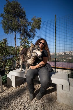 Helena Hesayne from Beirut Ethical Treatment for Animals and a dog who lives at the shelter.