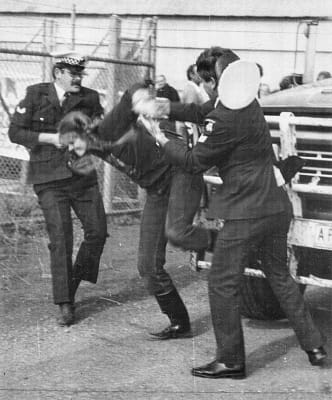 Patty Mark being arrested for her activism c.1980. This image was published in Animal Liberation Victoria's magazine in 1993 (photo supplied by Animal Liberation Victoria)