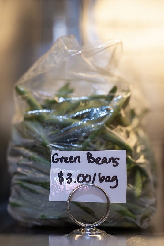 Fresh produce is sold at Brenda Sanders' Baltimore restaurant, The Greener Kitchen. Photo by: Jo-Anne McArthur / #UnboundProject / We Animals Media.